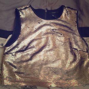 A silver shiny crop top